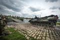 German Badger armoured engineer vehicle approaching a pontoon bridge formed of M3 Amphibious Rigs, 2016