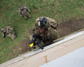 2nd Battalion The Royal Anglian Regiment storming a building at the Stanford Training Area, Norfolk, November 2015