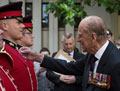 The Duke of Edinburgh awards Long Service and Good Conduct Medals to members of the Band of the Grenadier Guards, 21 May 2017