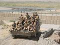 Group photograph, Household Cavalry Regiment with Scimitar tank in a defensive position, Helmand Province, Afghanistan, 2006