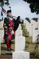 Pipe Major Darren Walker, 51st Highland Battalion at a Rededication Service, Hannover War Cemetery, Germany, 2016