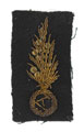 Trade badge for an ambulance driver, French Army, worn by Miss Olive M Tremagne Miles, Queen Alexandra's Imperial Military Nursing Services, 1914-1918
