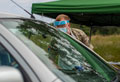 A member of 47 Regiment, Royal Artillery, talks to a visitor attending a COVID-19 Mobile Testing Unit, West Midlands, 12 June 2020