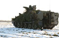 An assault section from The Light Dragoons disembarks from the back of Spartan armoured personnel carrier, Robertson Barracks, Norfolk, March 2004