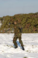 A member of The Light Dragoons takes aim with a snowball, Robertson Barracks, Norfolk, March 2004