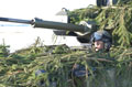 A Scimitar light tank driver of The Light Dragoons in a simulated assault, Robertson Barracks, Norfolk, March 2004