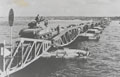 Sherman Tanks of the 2nd Battalion, Grenadier Guards, going ashore at Arromanches, June 1944