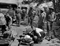 Indian medical orderlies assisting wounded, Burma, February 1944