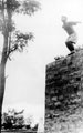 Recruit jumping from a wall, 5th Mahratta Light Infantry, Belgaum, 1943 (c)