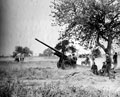 A 4.5 inch gun of 211 Battery, Royal Artillery, firing in support of infantry, Tilly-sur-Seulles, 13 June 1944