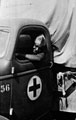 A member of the 10th Belgian Congo Casualty Clearing Station, leaning out of the window of an ambulance, Burma, 1944 (c)