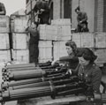 Two members of the Auxiliary Territorial Service check lend-lease Vickers machine guns, Central Ordnance Depot, Weedon, Northamptonshire, 1942