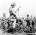 Checking captured Boer weapons, 1900 (c)