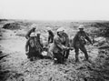 Soldiers evacuating a wounded man on a stretcher, 1917 (c)