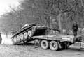 An A15 Crusader Mark I tank of 3rd County of London Yeomanry driving onto a White tank transporter, Parham, Sussex, 1941