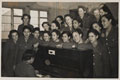 Members of the West Indies Auxiliary Territorial Service gathered around a piano, 1943 (c)