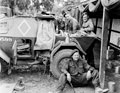'At work on a scout car', 3rd County of London Yeomanry (Sharpshooters), Westbury, Wiltshire, 1941