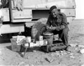 Sub-Conductor Mayland, Army Service Corps, preparing rations in the desert, 1941