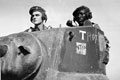 Lieutenant N E West and his wireless operator Sergeant Asmani bin Musa, in the turret of their tank, Burma, 1945