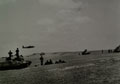 Mitchell Bombers pass overhead on a low level attack, 1942 (c)