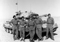 The crew of a 3rd County of London Yeomanry (Sharpshooters) Crusader tank in the desert, 1943 (c)