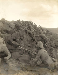 Canadian troops climbing a kopje, 1900 (c)