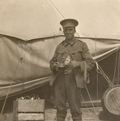 Sergeant Archie Favell stands outside a tent, 1916