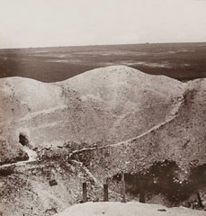 'Looking into the depths of the tremendous crater of our mine fired at La Boisselle on the Somme', 1918 (c)