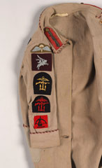 Child's dressing gown with formation badges sewn on it, 1940 (c)