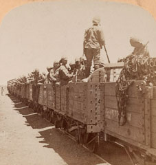 British soldiers aboard railway wagons, 1900 (c)