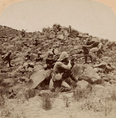 'The Warwicks skirmishing with Boers near Weppener, East of Bloemfontein, South Africa', staged photograph, 1901