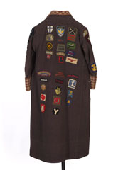 Child's dressing gown with cloth badges sewn on it, 1943 (c)