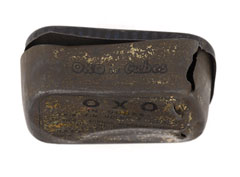 Oxo tin containing a spent bullet and a cardboard Oxo cube box, 1915 (c)
