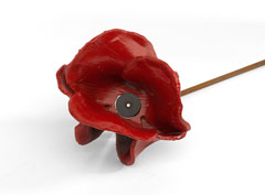 Ceramic poppy from the installation, 'Blood Swept Land and Seas of Red', marking the centenary of the outbreak of World War One, at the Tower of London, 2014