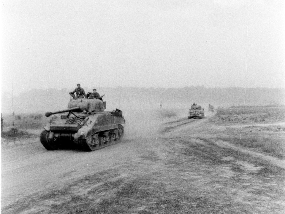 Sherman tanks on the move to Vire, Normandy, 1944