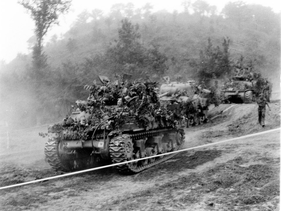 Sherman tanks on the move, Normandy, 1944