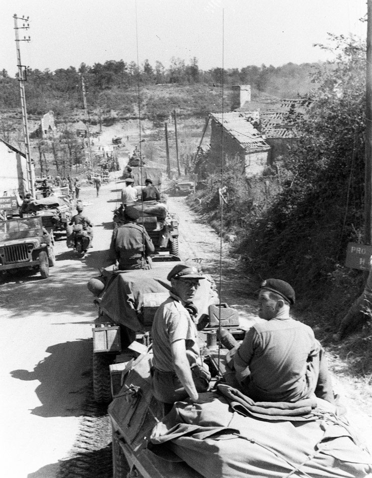 'Major John Aitken MC and the recce party moving off to reconnoitre a new area', Normandy, 1944