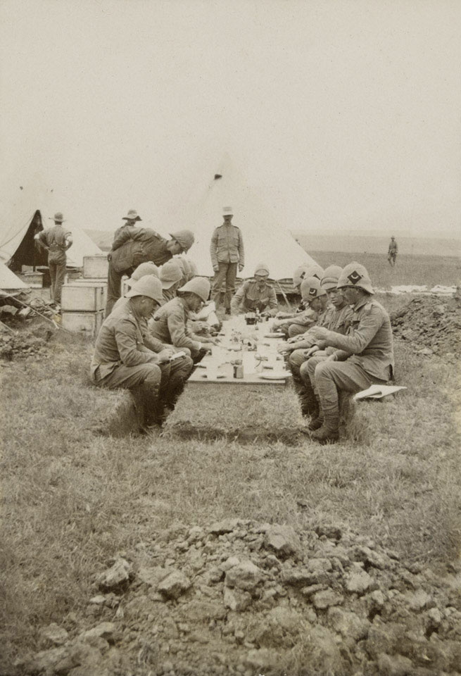 Officers at luncheon in the field, 1900 (c)