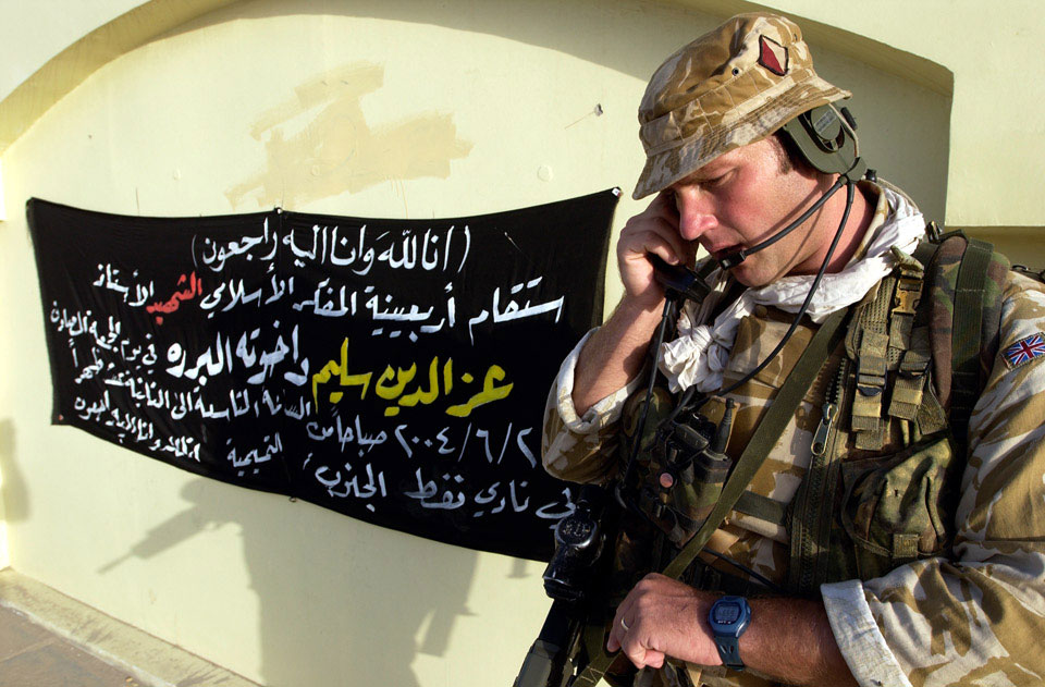 A colour sergeant of 1st Battalion Cheshire Regiment, carries out a 'Radio Check', Iraq, June 2004