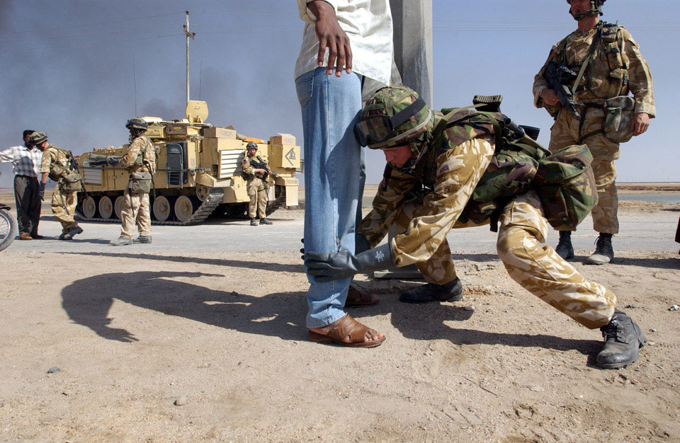Soldiers serving with the 1st Battalion Irish Guards at a checkpoint near Basra, Iraq, March 2003