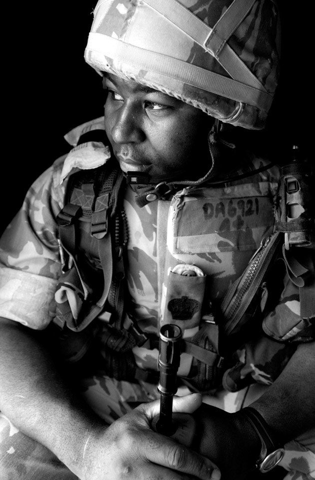 A reservist serving with the Territorial Army London Regiment (Royal Green Jackets), in the role of a Community Liaison Officer, Iraq, July 2004.