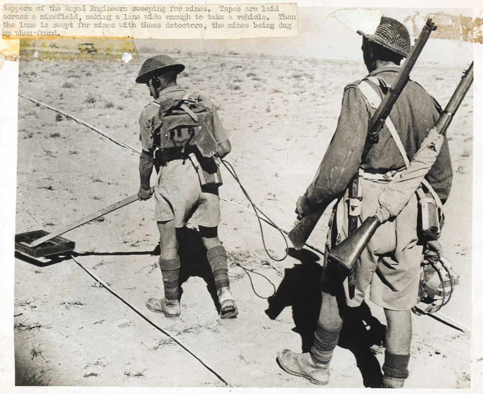 Two sappers of the Royal Engineers using detectors to sweep for mines, Egypt, 1942 (c)