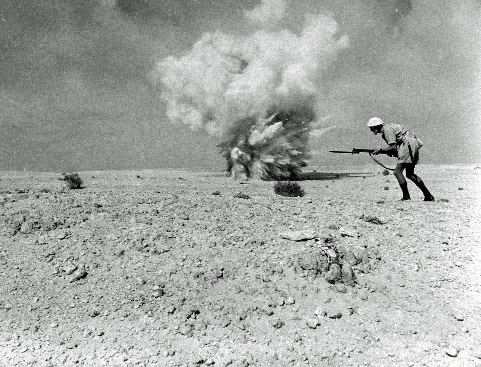 British infantryman in desert fatigues advancing with fixed-bayonet, El Alamein, 1942