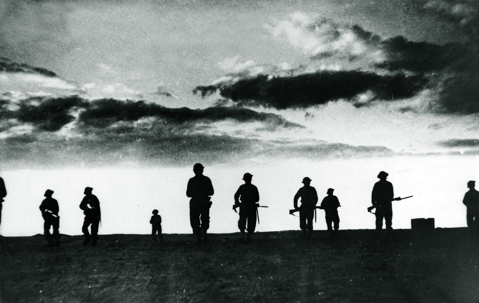 British infantry silhouetted against the setting sun, El Alamein, 1942
