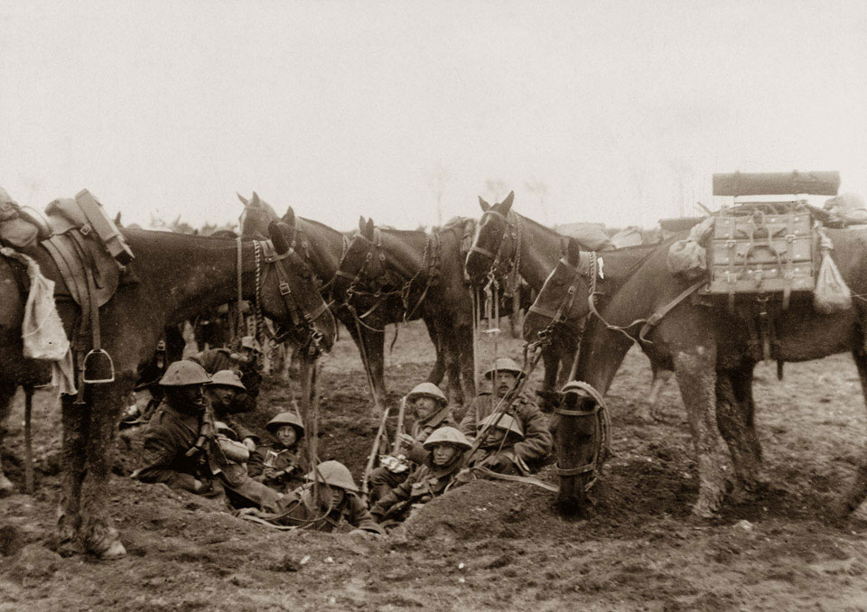 Cavalrymen resting in a shell hole on the Arras-Cambrai Road during the Battle of the Scarpe, April 1917