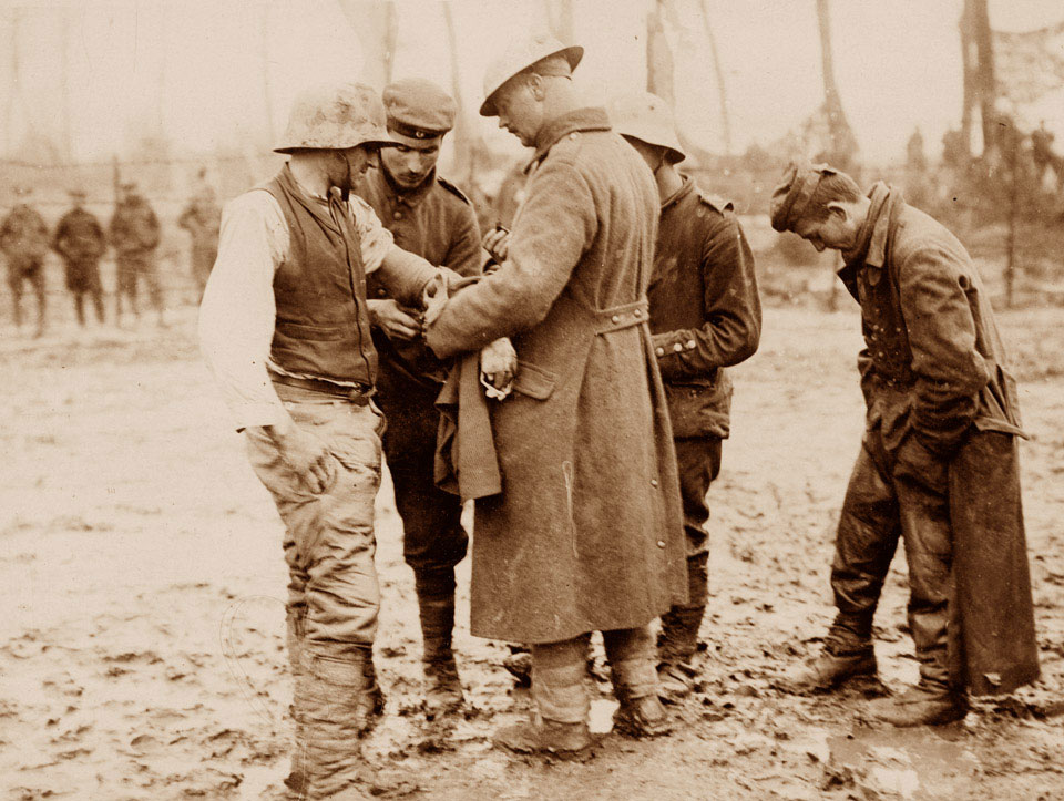 Treating a wounded German prisoner near Langemarck, 26 September 1917