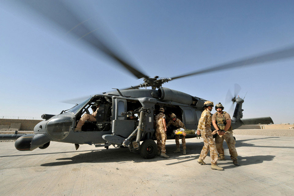 Patients are flown into the Medical centre at Lashkar Gah, Helmand, 2009