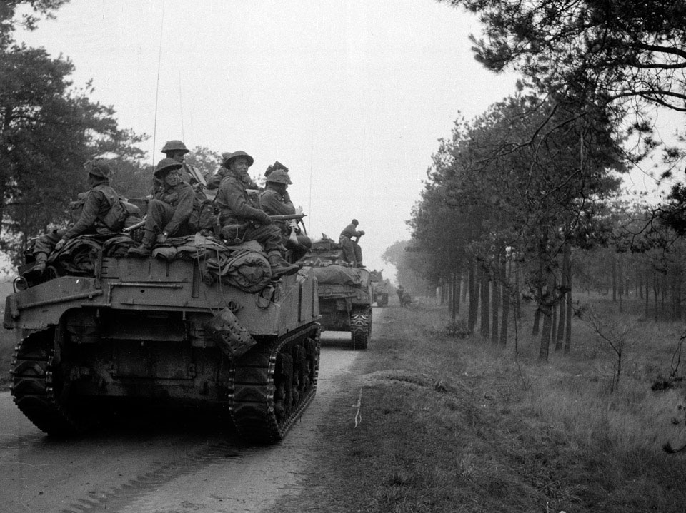 'Infantry of the Dutch Prinses Irene Brigade riding on 'A' Squadron tanks during the approach to attack Tilburg', Holland, 1944