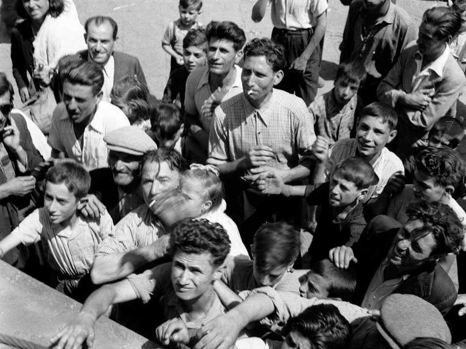 'Populace scrambling for food at Mascalucia', Sicily, 1943
