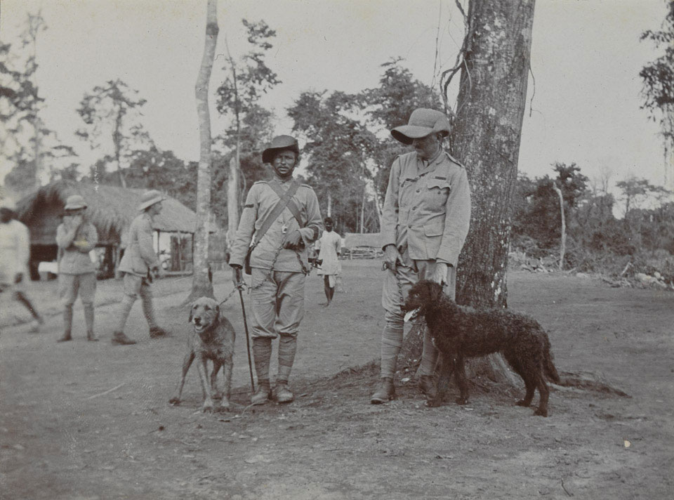 Two soldiers of 1st Battalion, 8th Gurkha Rifles, with dogs, 1911 (c)